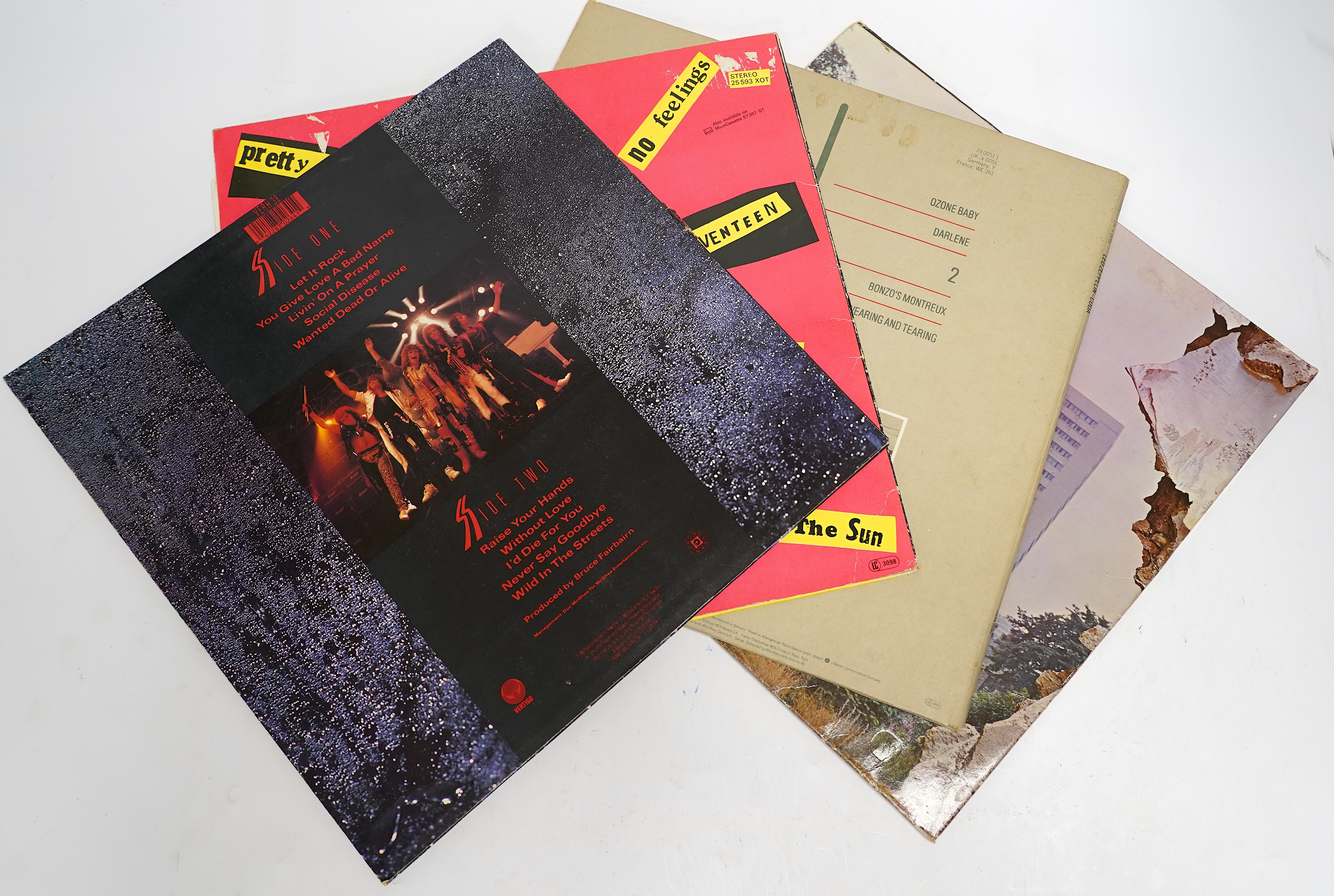 Fifty-five LP record albums, artists including; Led Zeppelin, Sex Pistols, The Stranglers, Madness, Fleetwood Mac, The Doors, Dire Straits, The Damned, AC/DC, Phil Collins, Santana, Simply Red, Genesis, Eric Clapton, The